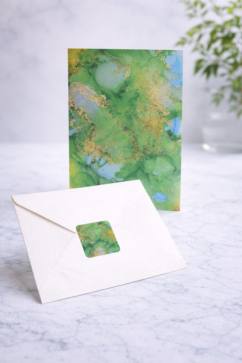 Greeting card with watercolor design on a marble surface