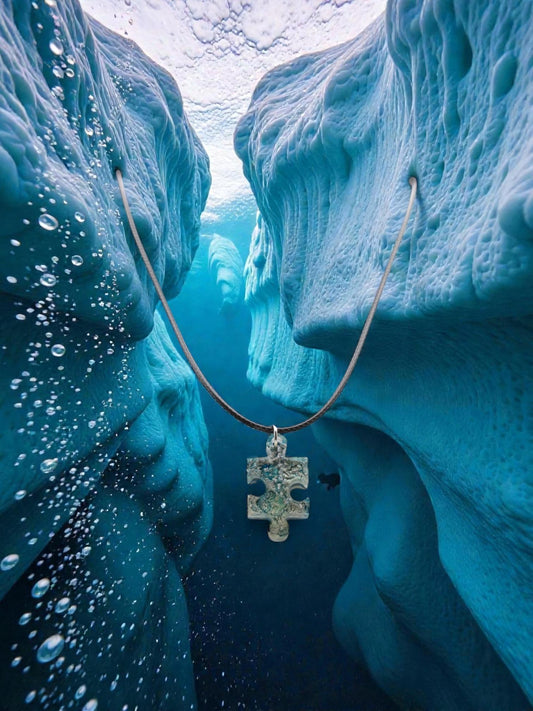 Necklace with a pendant hanging from ice formations underwater