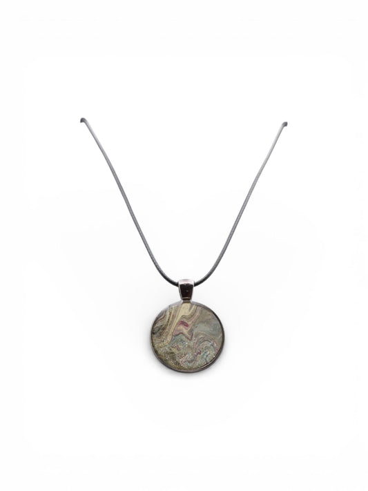 English Tea, Porthole of Joy necklace with a round pendant on a white background