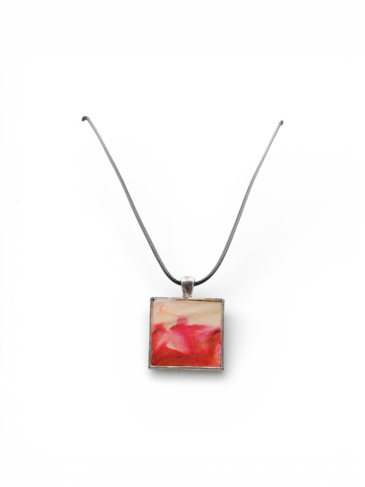 Necklace with a square pendant featuring a floral design on a white background