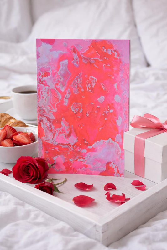 Loving You greeting card on romantic breakfast tray on bed, with roses and gift.
