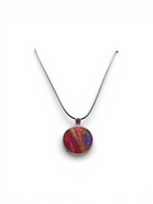 Multicolored pendant on a cord against a white background