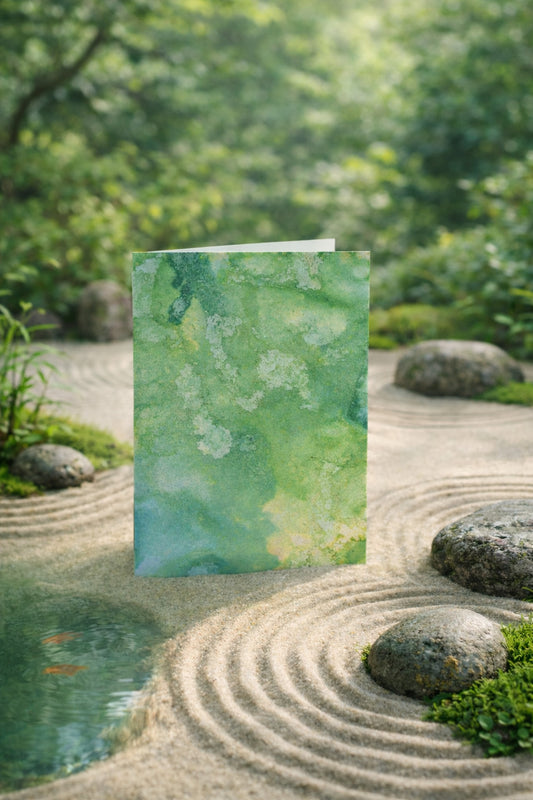 Greeting card with green abstract design in a zen garden setting